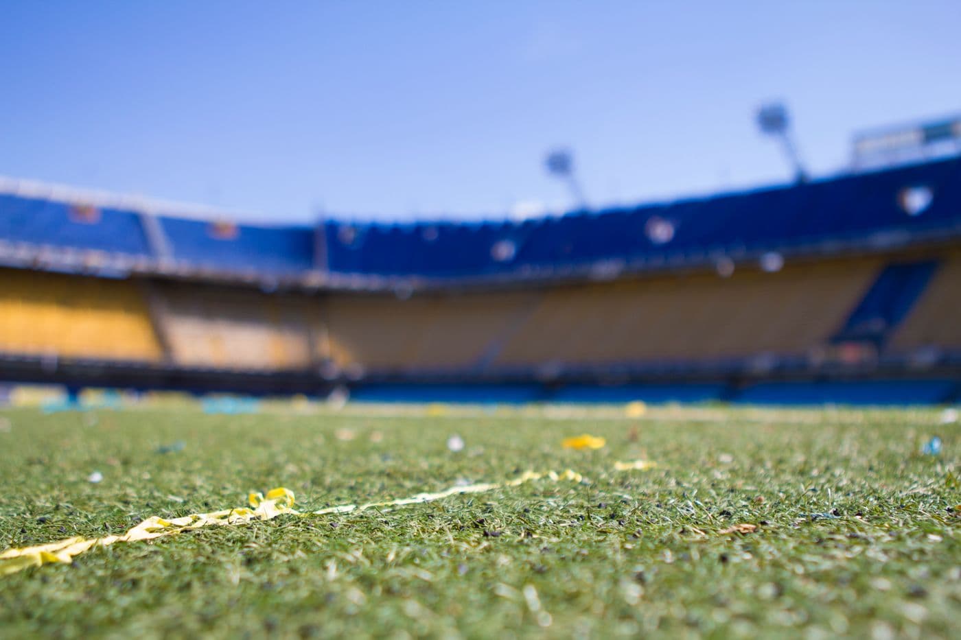 Empty football stadium seen from pitch level