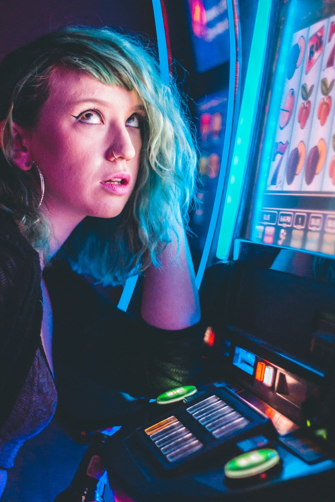 Player at a neon slot machine